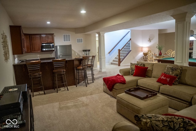 living room with light carpet, indoor bar, and billiards