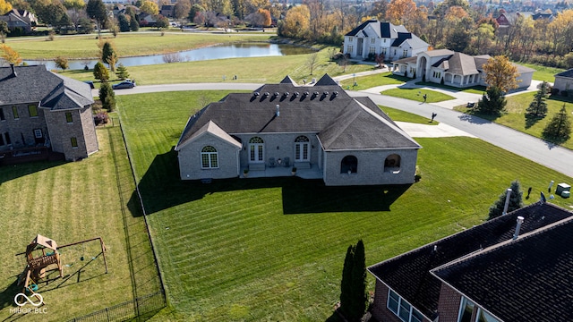 birds eye view of property featuring a water view