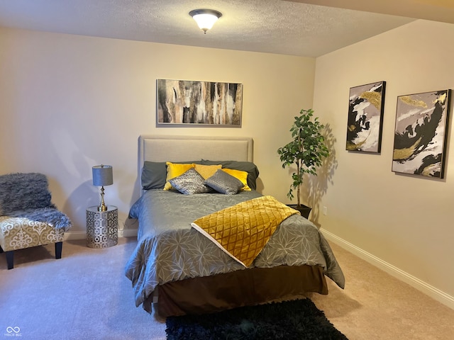 carpeted bedroom featuring a textured ceiling