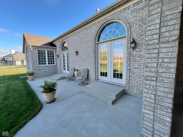 rear view of property featuring a patio area and french doors