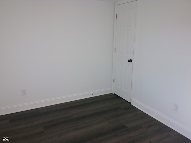 spare room featuring dark hardwood / wood-style floors