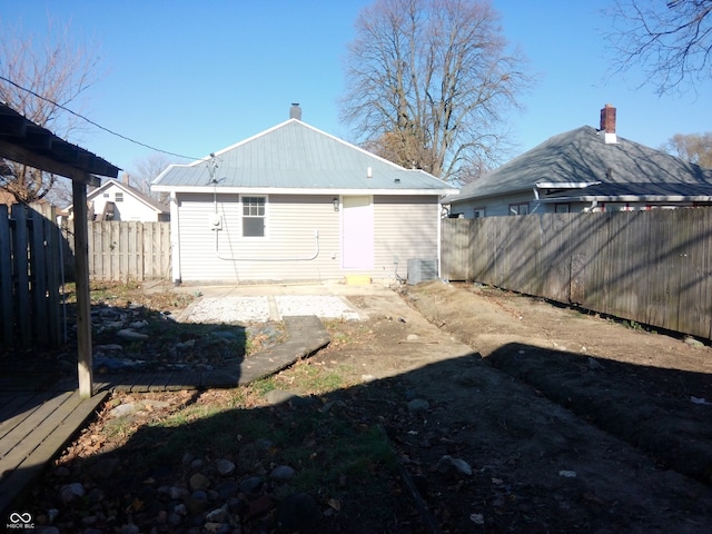 back of property featuring central air condition unit