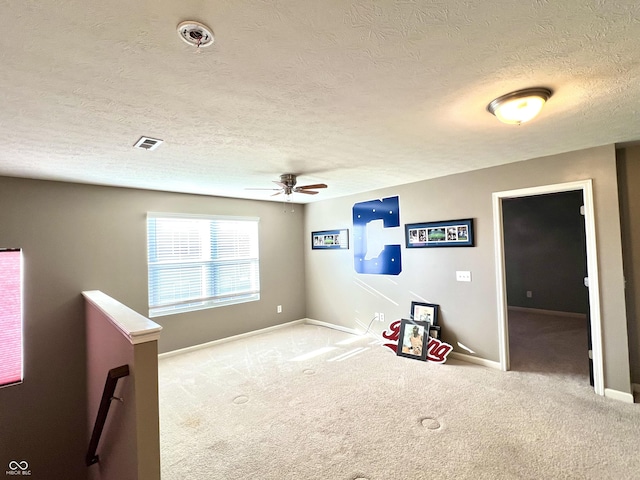 5778 W Commonview Dr, Mccordsville, IN 46055 - recreation room featuring ceiling fan, carpet, baseboards, and a textured ceiling