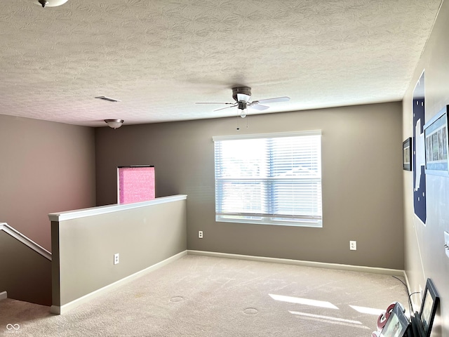 5778 W Commonview Dr, Mccordsville, IN 46055 - carpeted spare room with a ceiling fan, baseboards, and a textured ceiling