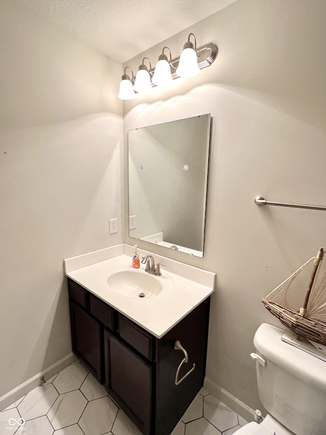 5778 W Commonview Dr, Mccordsville, IN 46055 - bathroom featuring toilet, vanity, baseboards, tile patterned flooring, and a textured ceiling