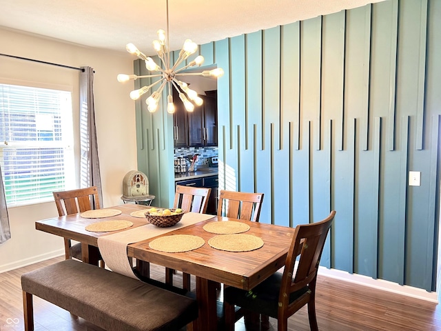 5778 W Commonview Dr, Mccordsville, IN 46055 - dining area featuring a chandelier, light wood finished floors, and baseboards