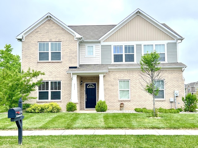 5778 W Commonview Dr, Mccordsville, IN 46055 - view of front of home featuring brick siding, a front yard, and a shingled roof