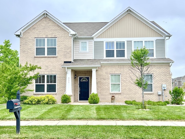 5778 W Commonview Dr, Mccordsville, IN 46055 - view of front of home with a front lawn, brick siding, and board and batten siding