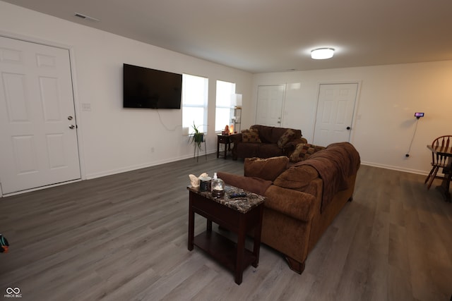 living room with dark wood-type flooring