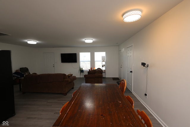 dining space featuring dark hardwood / wood-style flooring