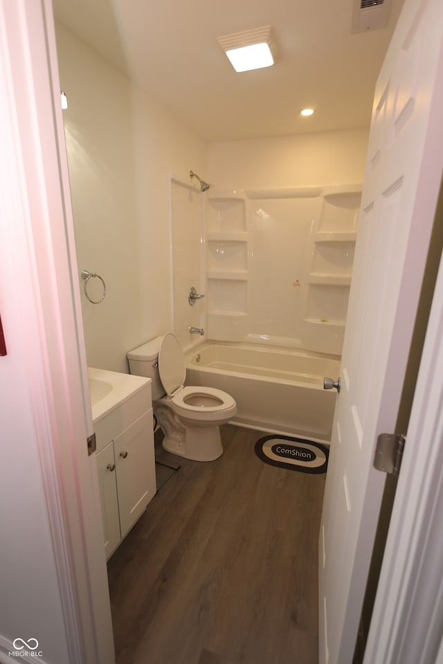 full bathroom featuring toilet, shower / bath combination, vanity, and hardwood / wood-style floors