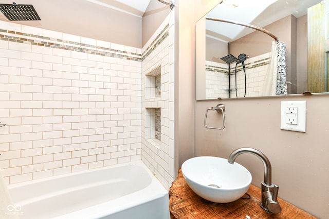 bathroom with shower / bathtub combination with curtain