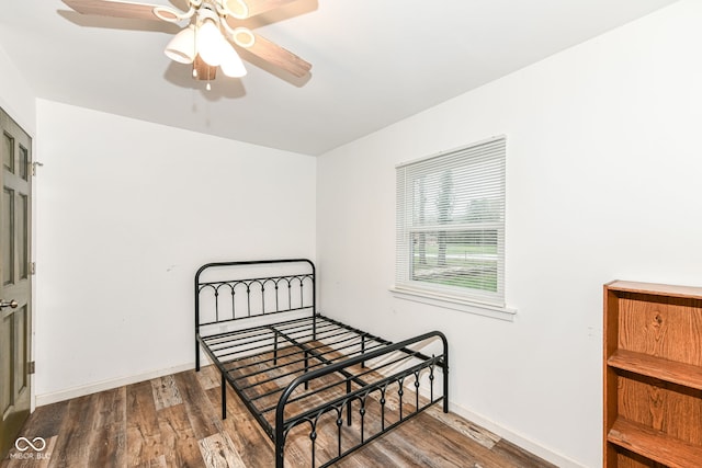 bedroom featuring ceiling fan and wood-type flooring