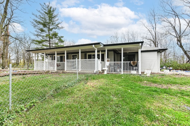 view of front of house featuring covered porch and a front lawn