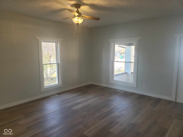 325 E Church St, Paragon, IN 46166 - unfurnished room with ceiling fan, dark wood-style floors, a textured ceiling, and baseboards