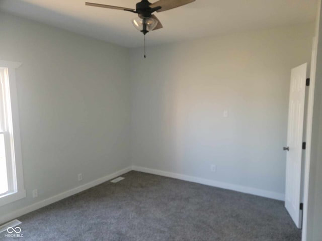 325 E Church St, Paragon, IN 46166 - empty room with dark carpet, ceiling fan, and baseboards