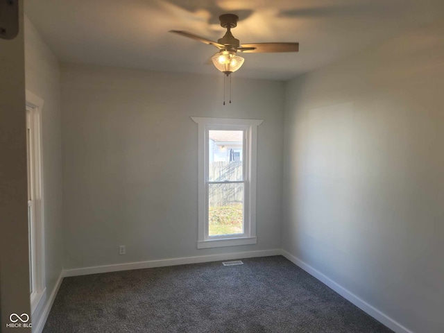 325 E Church St, Paragon, IN 46166 - unfurnished room featuring dark colored carpet, a ceiling fan, and baseboards