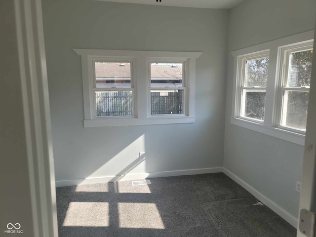325 E Church St, Paragon, IN 46166 - spare room featuring dark carpet and baseboards