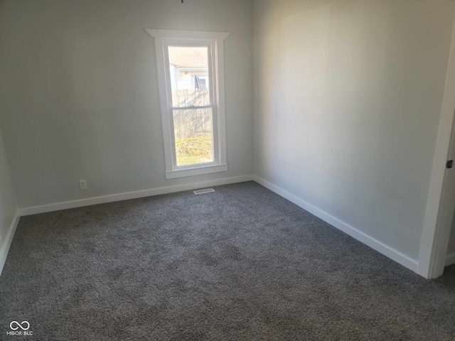 325 E Church St, Paragon, IN 46166 - unfurnished room with dark carpet and baseboards