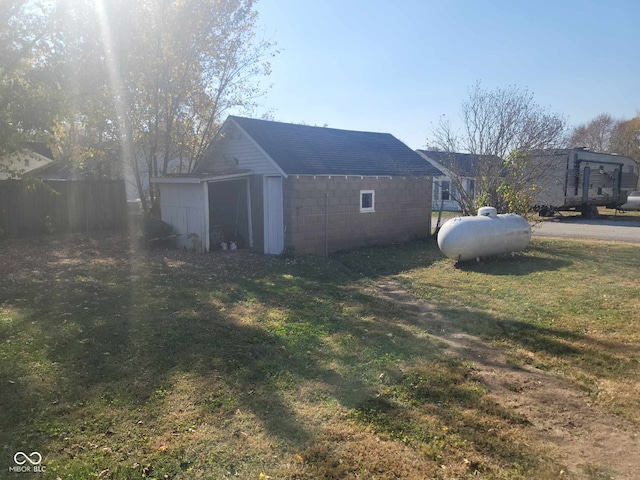 325 E Church St, Paragon, IN 46166 - view of side of home with concrete block siding and an outdoor structure