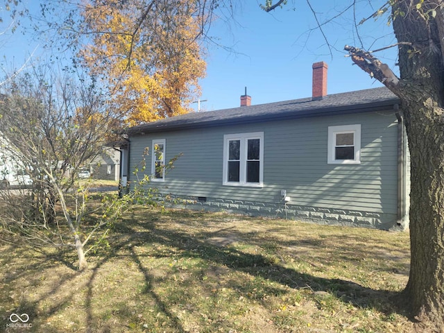 325 E Church St, Paragon, IN 46166 - rear view of house featuring a chimney, crawl space, a yard, and a shingled roof