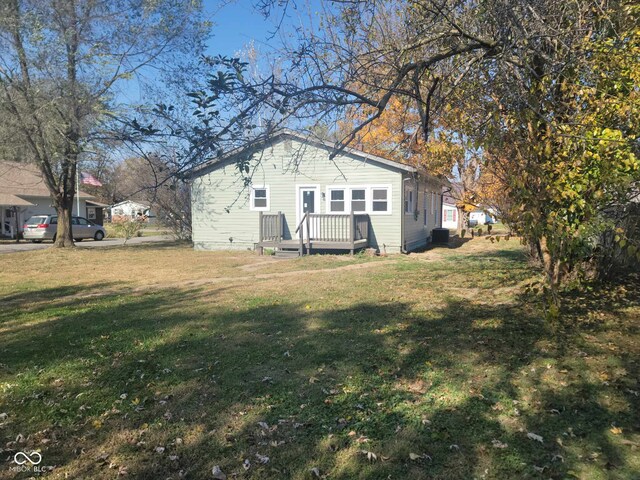 325 E Church St, Paragon, IN 46166 - view of grassy yard with central AC