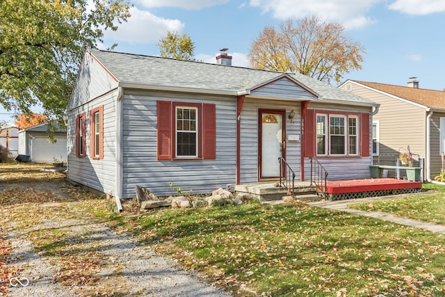 view of front of home featuring a wooden deck and a front yard