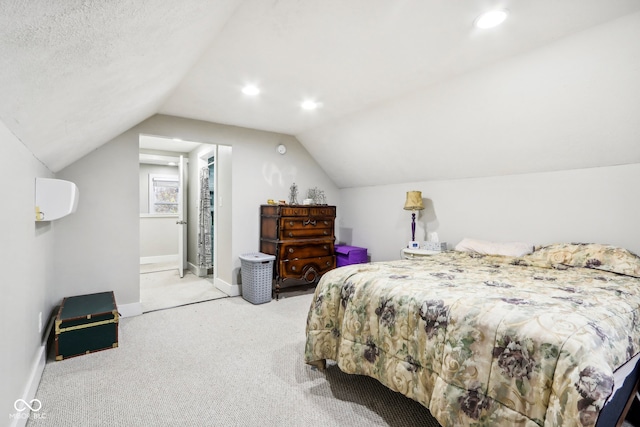 carpeted bedroom featuring lofted ceiling and a textured ceiling