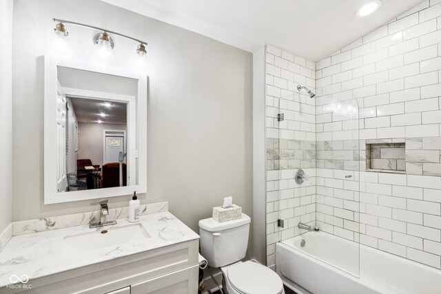 2028 Hoyt Ave, Indianapolis, IN 46203 - bathroom featuring vanity, bathtub / shower combination, toilet, and ensuite bathroom