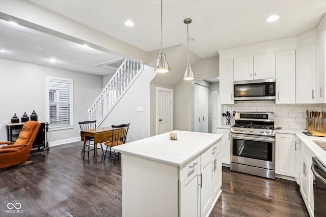 2028 Hoyt Ave, Indianapolis, IN 46203 - kitchen with stainless steel appliances, dark wood-type flooring, decorative backsplash, recessed lighting, and pendant lighting