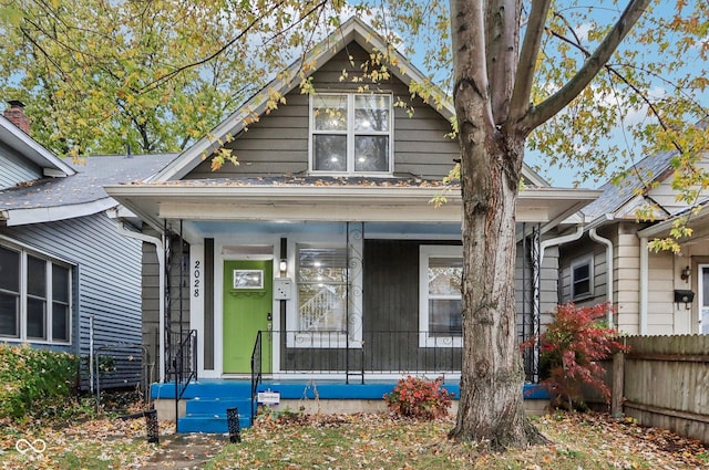 2028 Hoyt Ave, Indianapolis, IN 46203 - shotgun-style home with a porch