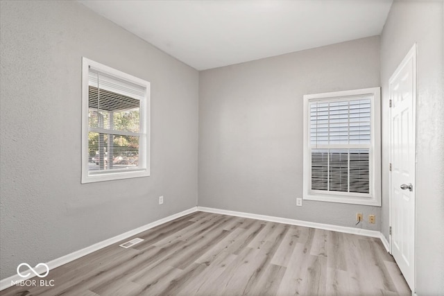 empty room with light wood-type flooring