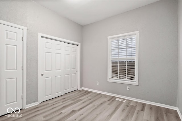 unfurnished bedroom featuring light hardwood / wood-style floors