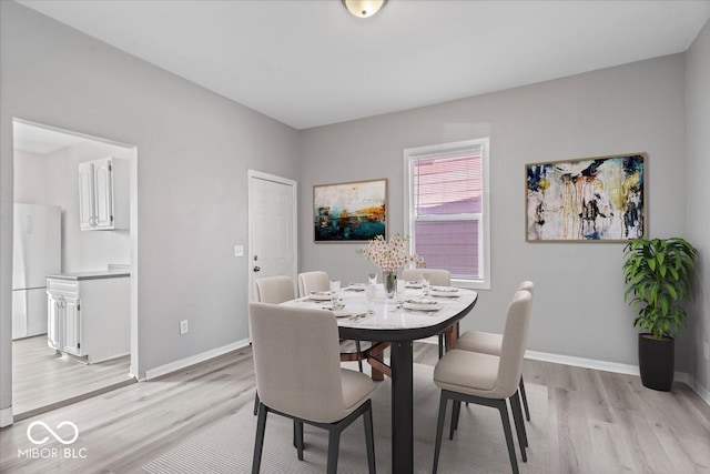 dining room featuring light wood-type flooring