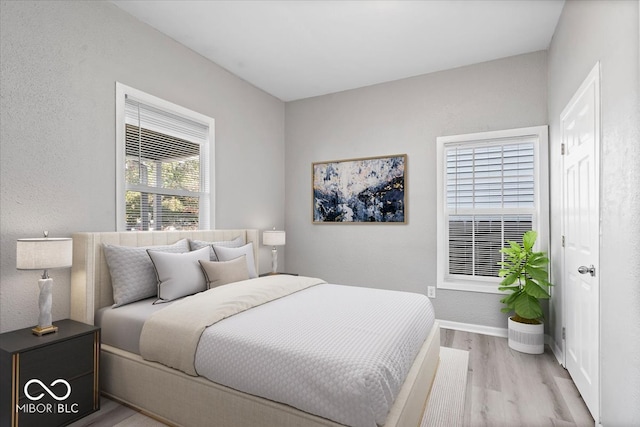 bedroom with light hardwood / wood-style floors