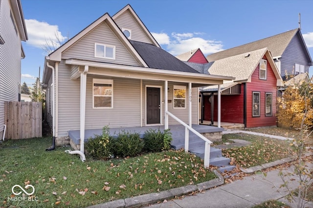 bungalow-style home featuring a front yard and a porch