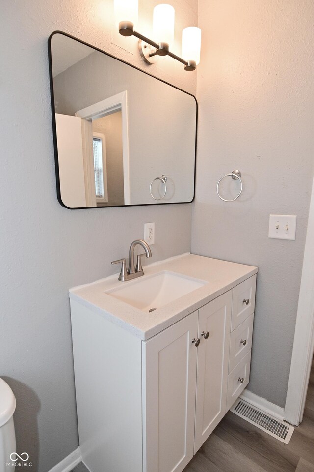 1709 Hoyt Ave, Indianapolis, IN 46203 - bathroom with vanity and wood finished floors