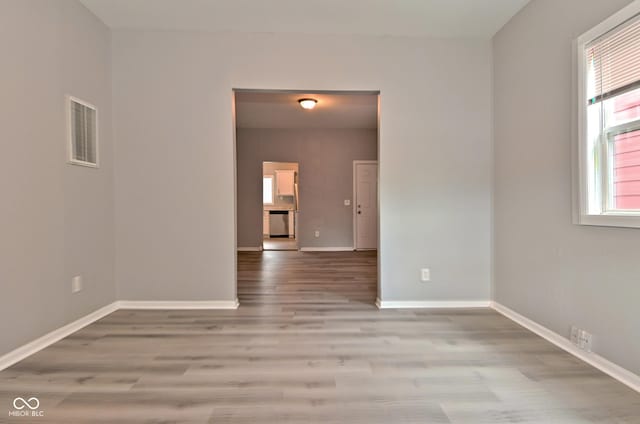1709 Hoyt Ave, Indianapolis, IN 46203 - empty room featuring light wood-type flooring and baseboards
