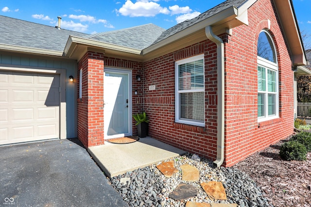 entrance to property featuring a garage