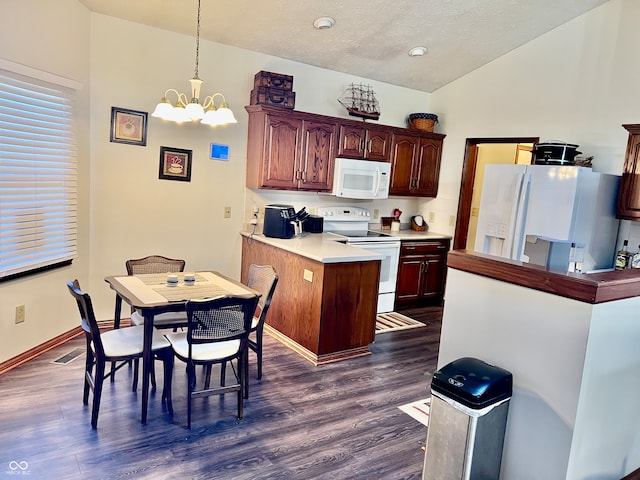 kitchen featuring white appliances, hanging light fixtures, lofted ceiling, a notable chandelier, and dark hardwood / wood-style floors