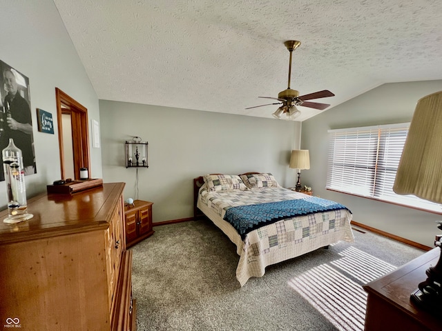 carpeted bedroom with a textured ceiling, ceiling fan, and vaulted ceiling