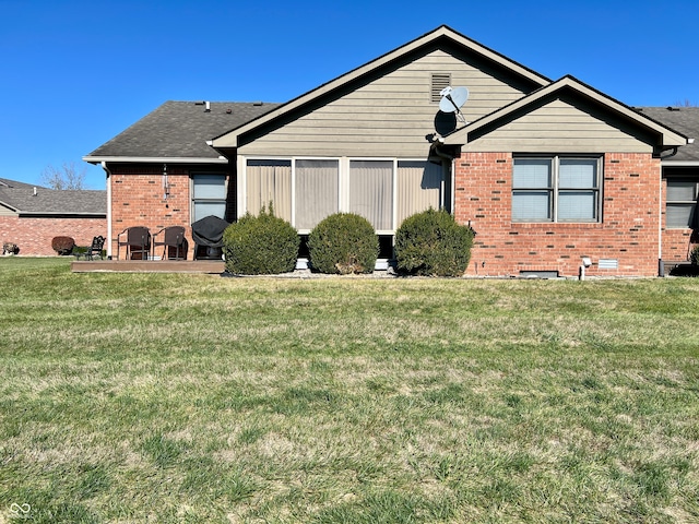 view of front of home with a front lawn and a patio