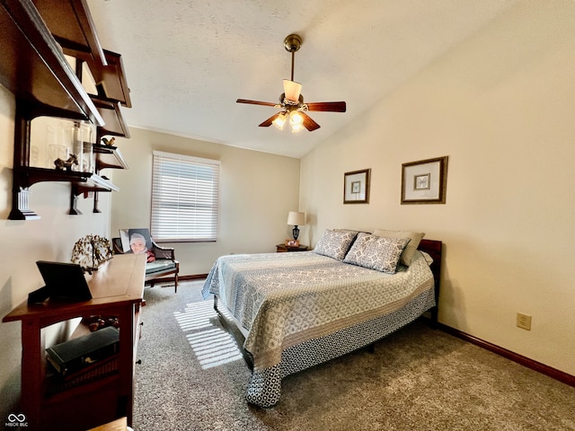 bedroom with lofted ceiling, a textured ceiling, carpet, and ceiling fan