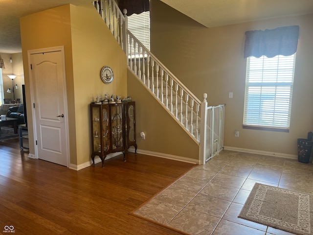 stairs with hardwood / wood-style flooring