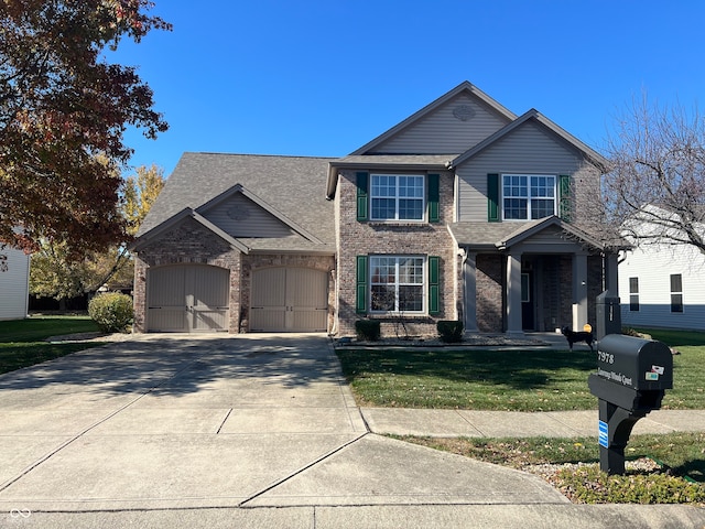 view of front facade with a front yard and a garage