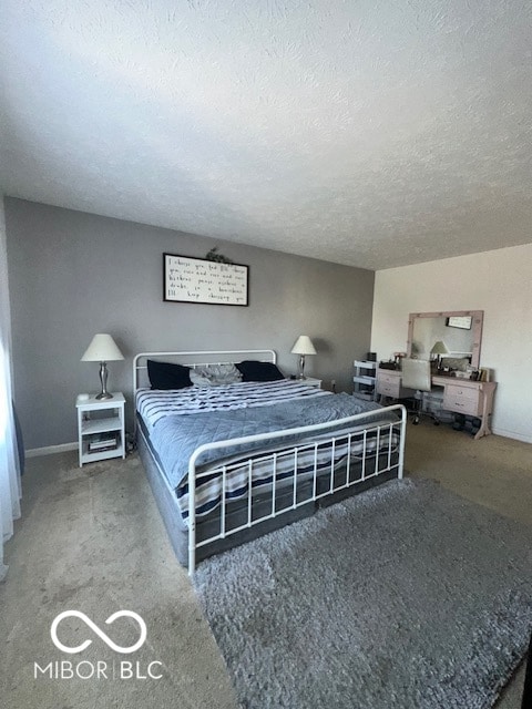 carpeted bedroom with a textured ceiling