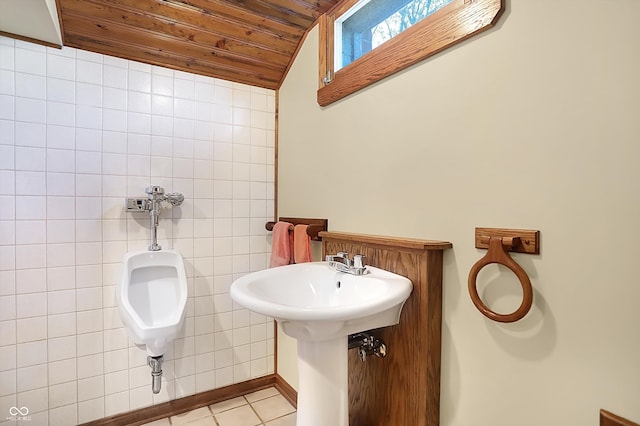 bathroom featuring tile walls, tile patterned floors, vaulted ceiling, and wooden ceiling