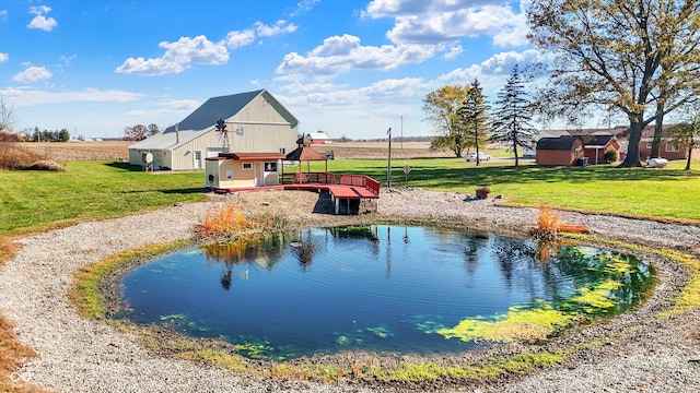 view of swimming pool with a yard and a deck