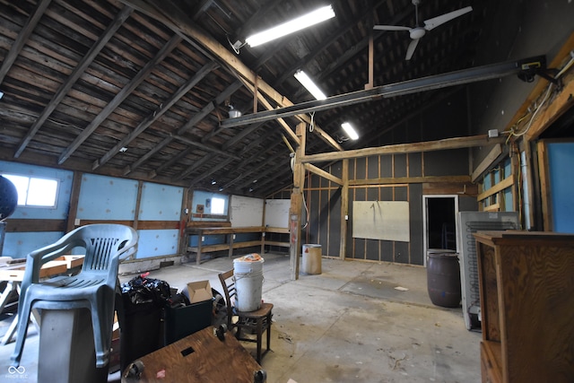 miscellaneous room featuring concrete flooring, lofted ceiling, and ceiling fan