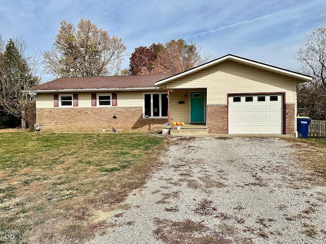 single story home with a front lawn and a garage